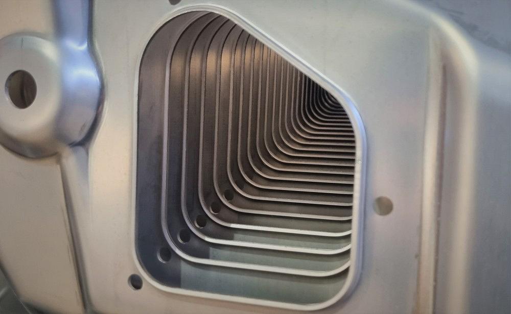 Series-produced metal press parts – close-up view Close-up view of stacked metal press parts in series production